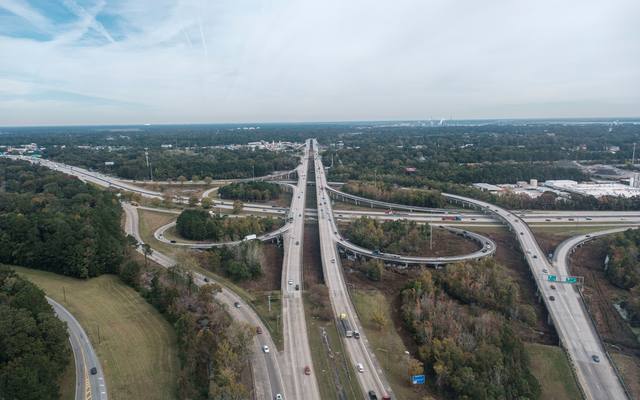 Aerial view of a highway interchange and its curving ramps