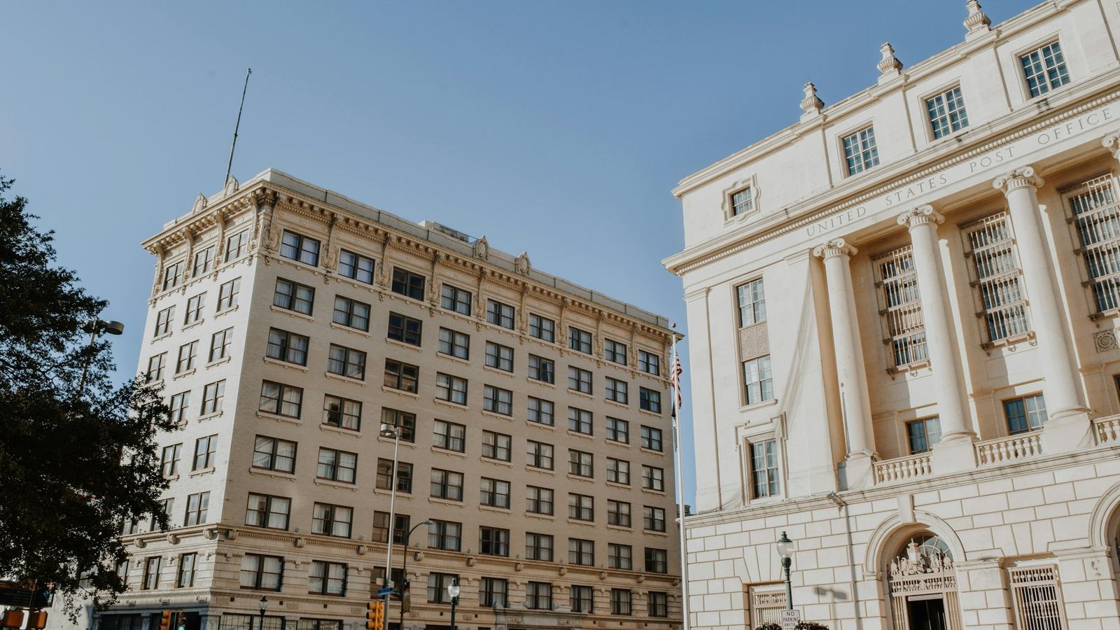 Brick and limestone office buildings at a downtown San Antonio corner