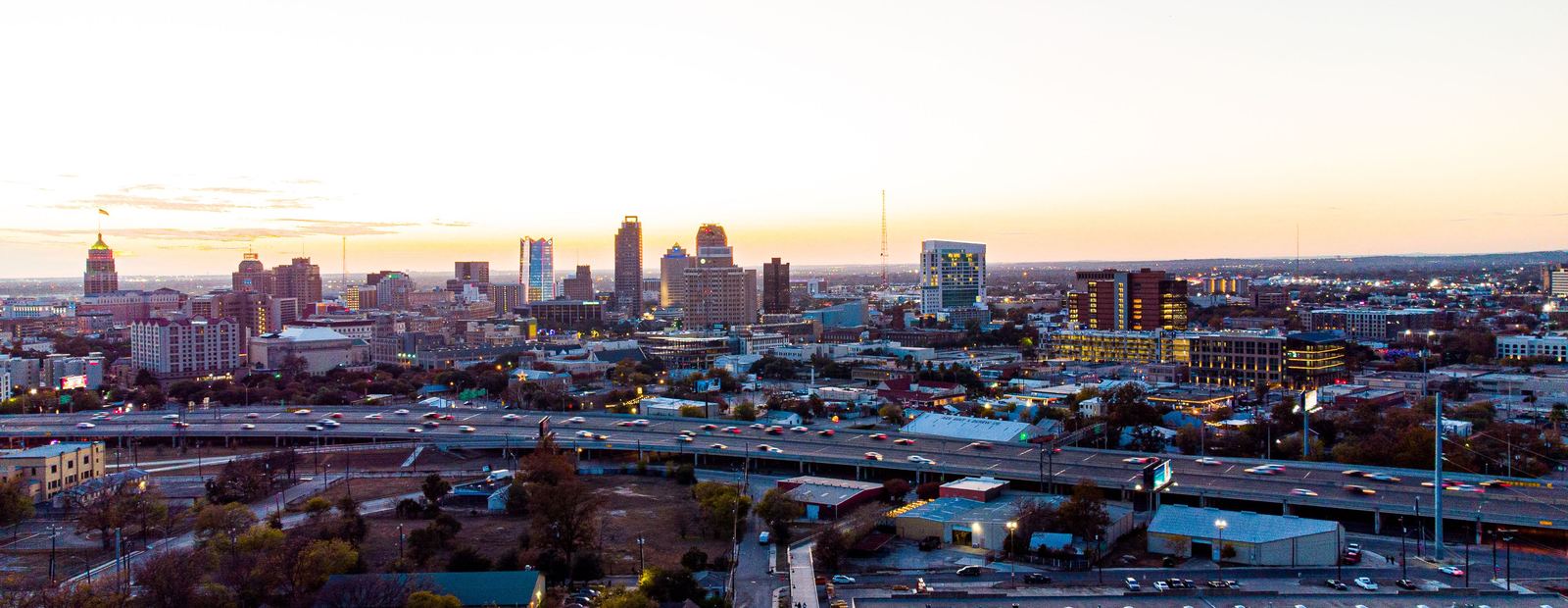 Aerial view of downtown San Antonio and its highways at dusk