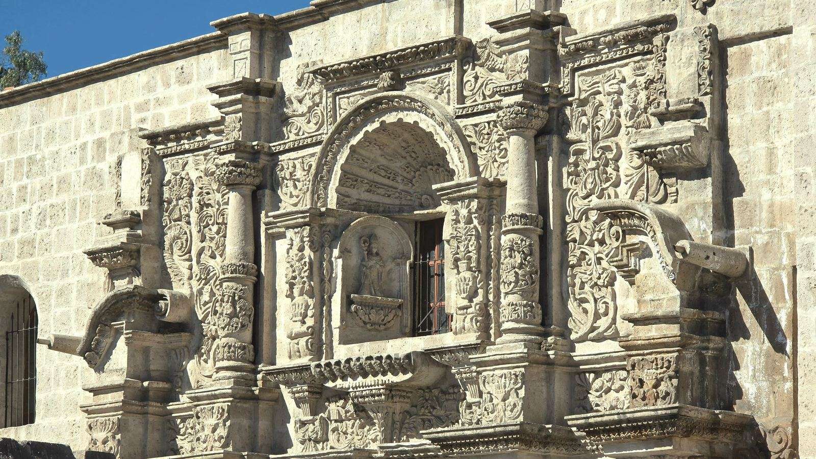 Carved stone portal of a Spanish colonial mission church in San Antonio