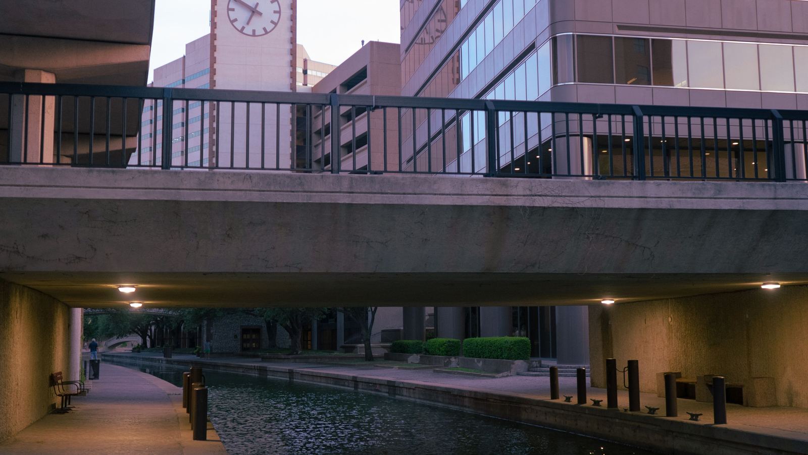 Quiet stretch of the San Antonio River beneath a downtown overpass